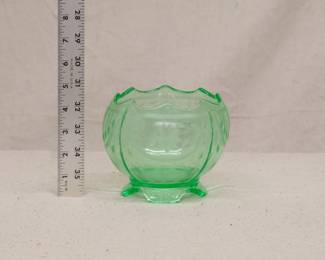 An EAPG vaseline / uranium glass rose bowl with wheel cut floral design, on tabbed feet