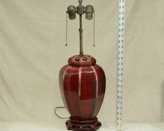 Chinese style Sang de Boeuf oxblood glaze porcelain vase lamp with carved wooden cap and base