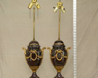 A pair of neoclassical style ormolu or gilt bronze and marble urn form lamps