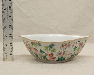 A Chinese export porcelain polychrome enamel bowl in bat form with floral decoration including lotus, chrysanthemum, peony, plum blossoms; six-character mark on base.