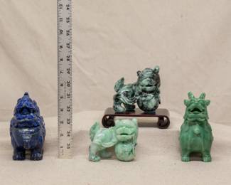 A pair of Chinese carved hardstone foo dogs or temple lions, one with wooden stand; and a pair of Chinese carved hardstone incense censers in the form of mythical auspicious beasts 