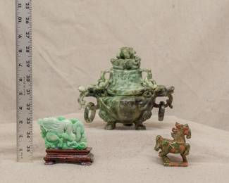 Another view of the finely carved Chinese jade sculpture of a dragon amidst scrolling clouds; a Chinese carved hard stone lidded incense burner, and a small hard stone carving of a horse