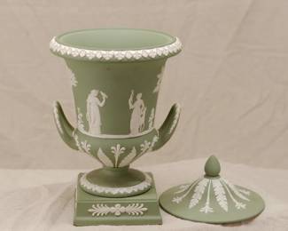 Another view of the vintage Wedgwood green jasper ware double handled covered urn on plinth, decorated with cream color sprig depicting Classical figures