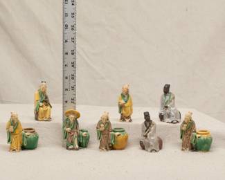 A collection of Chinese Shiwan ceramic mud men figures in Sancai glaze