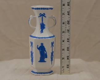 Antique c. 1820 Wedgwood white jasper two-handled vase with applied blue sprig classical Greek figures and both arts and military symbols decoration. Stamped Wedgwood to the base – each letter individually stamped in —and a blue sprig oval embossed "pad mark" showing the numerals 979 for the shape number.