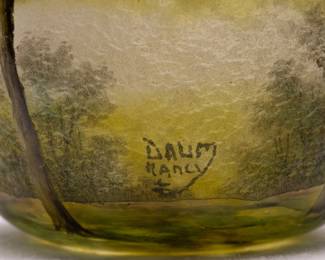 Closeup of the Daum Nancy cameo glass vase with a forest view, signed