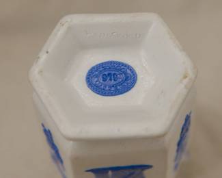 Closeup of antique c. 1820 Wedgwood white jasper two-handled vase with applied blue sprig classical Greek figures and both arts and military symbols decoration. Stamped Wedgwood to the base – each letter individually stamped in —and a blue sprig oval embossed "pad mark" showing the numerals 979 for the shape number.