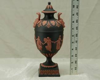 A marvelous Wedgwood black basalt 'Dancing Hours' lidded urn with applied terracotta relief and Bacchus head handles. Exquisitely fine modeling on this museum quality piece!