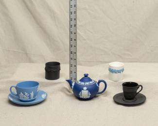 Vintage Wedgwood jasperware cup and saucer, dark blue jasperware teapot, Queen's Ware embossed cigarette holder and a black basalt embossed cigarette holder, and a black basalt cup and saucer 
