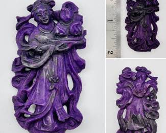 A Chinese carved hard stone figure of an immortal, likely Xiwangmu ("Queen Mother of the West") holding a dish of peaches, a Daoist symbol of immortality