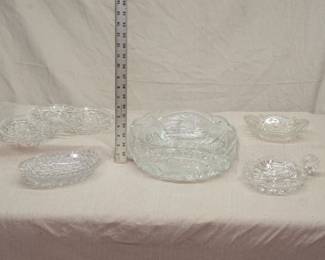 Collectible clear cut glass including a vintage Anchor Hocking Prescut sawtooth pinwheel design dish, American Brilliant Period cut glass pickle dishes and saucers, and a gorgeous large cut glass serving or fruit bowl 