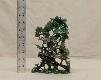 Another view of the large Chinese spinach jade carving of a phoenix bird in a flowering tree peony 