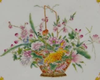 Closeup of a pair of vintage Chinese export porcelain plaques skillfully hand painted in Famille Rose enamels. Central design of baskets of flowers inside a blue enamel scrolling foliage band edged with a yellow spearhead border. Very fine shading and depiction of the flowers including morning glory, chrysanthemum, peony, lotus, and roses. Unsigned on the front, sealed in wood frames.