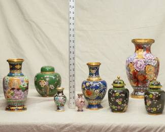 A splendid selection of Chinese Cloisonné vases, ginger jars and lidded urn jars, finely decorated in colorful enamels and polished brass; exceptional Cloisonné work in multiple colors with beautiful clouds, birds, flowering plum, chrysanthemum and peony, and geometric patterns throughout.