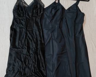 Vintage women's slips, lingerie in black, some edged in lace