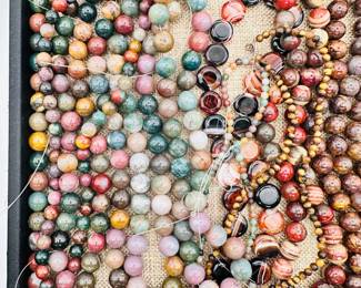 Make your own necklace from these strings of polished natural stone beads