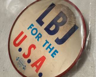 One LBJ pin, changes from picture to message with a slight tilt. I know there is a word for this, but for the life of me I can't think of it.