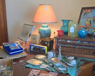 Sterling silver pieces are sitting atop the piano. I also found the lid to the Vaseline glass!