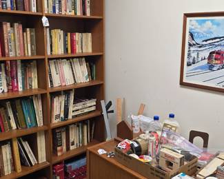 The print on the wall is signed and numbered.