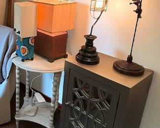 Lots of lamps, small occasional tables and cabinets