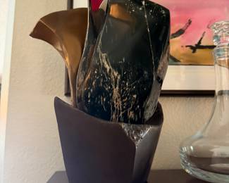 #15 - $1,200 - Sid Kamerman (Born in NY 1943-2016)"Sacred & Secular" 12x9 Highly polished Wyoming jade, polished stai nless steel, and bronze characterize this unique sculpture symoblizing ancient values and power to modern function and durability. 