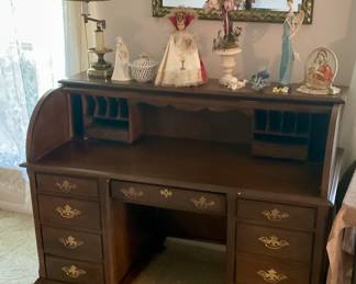 Roll top desk, religious figures, lamp, mirror, figures