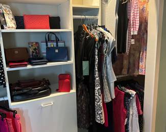 Ladies clothing, many items still have tags on them 