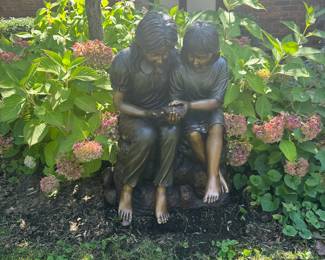 Bronze girls with bird 