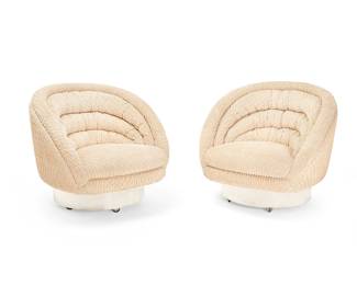 259
Vladimir Kagan (1927-2016)
A pair of swivel chairs, late 20th century
Each with tag applied to underside: Vladimir Kagan Designs Inc.
The barrel-style lounge chairs, each with tan textured boucle fabric upholstery, raised on a swiveling round wood base with polished metal siding, raised on casters
2 pieces
Each: 30.75" H x 35.5" Dia.
Estimate: $2,000 - $4,000