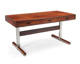 26
A Ganddal Møbelfabrik rosewood desk
Mid-20th century
With sticker to underside: GM / Ganddal Møbelfabrikk A/S / Mad in Norway; stamped: 9 / 74
The desk with three drawers above wood and chromed metal trestle supports
28.75" H x 55.25" W x 26.75" D
Estimate: $1,200 - $1,800