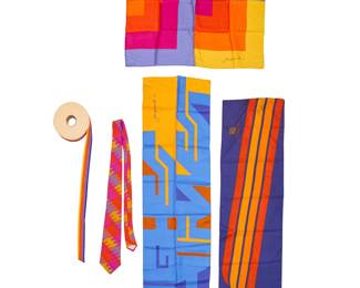 358
A group of Mario Armond Zamparelli and Company for Hughes Airwest accessories
Circa 1970s
Each scarf signed and two dated to weave; two with label: Echo / Made in Japan; Tie with label: Career Cravats
Five works comprising three scarves with various geometric designs including a multicolored square silk scarf, 1975 (26.5" x 26.5"), a long narrow polyester scarf in blues, tan, and yellow, 1977 (51.5" x 13"), and a long narrow polyester scarf with a blue, yellow, and orange multistripe design (49" x 12"), as well as a 50-yard roll of multicolored five-stripe grosgrain acetate ribbon trim, for 1972 uniforms (7" Dia. approximately x 1.5" H), a multicolored tie featuring Hughes Airwest "triple fuselage" branded fabric (56" x 4"), and a group of three promotional photographs featuring the silk scarves
8 pieces
Estimate: $150 - $250