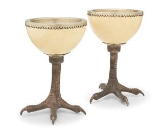 221
Anthony Redmile (1940-2016)
A pair of ostrich egg goblets, circa 1980s
Each marked to the base: redmile London
Each egg with metal lining, set on a silver-plated metal bird foot-form base
2 pieces
Each: 7.75" H x 6" W x 5.5" D approximately
Estimate: $500 - $700