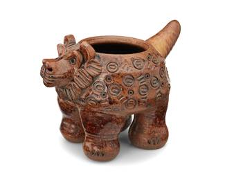 76
Dora De Larios (1933-2018)
A glazed stoneware lion effigy vessel, late 20th/early 21st century
Incised to underside: Dora
The lion figure with impressed pattern to body
7.25" H x 9.875" W x 6.75" D
Estimate: $800 - $1,200