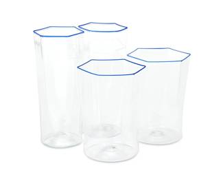 56
Carlo Scarpa (1906-1978)
A suite of blown glassware for Venini, circa 1935
Each unmarked
Comprising 18 highball glasses (5.5" H x 2.5" W x 2.125" D) and 3 tumblers (4.5" H x 3.125" W x 2.875" D), each with blue hexagonal rim
21 pieces
Estimate: $800 - $1,200