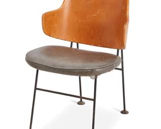 239
Ib Kofod-Larsen (1921-2003)
A 'Penguin' side chair for Selig, mid-20th century
Designed 1953
Appears unmarked
The dining chair with enameled metal frame, featuring a plywood scoop back above a grey leather upholstered seat cushion
33" H x 21.75" W x 23" D
Estimate: $600 - $800