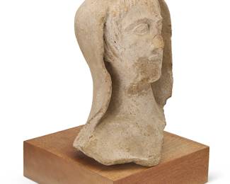 322
An Etruscan terra cotta votive head of a woman
Circa 350 BCE
Marked to underside of wood base: Zamparelli
Bust: 13.5" H x 9" W x 9.5" D; Overall: 16.75" H x 10.5" W x 10.5" D
Estimate: $800 - $1,200
