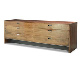 274
Robert Baron (1925-2014)
A walnut low dresser for Glenn of California, late 20th century
Lacking manufacturer's label to interior of top drawer
The six-drawer dresser with inset metal handles and case accents
28.25" H x 84.25" W x 20" D
Estimate: $700 - $900