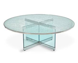 261
Steve Chase (1941-1994)
A Modern glass coffee table, late 20th century
Unmarked
The glass X-form base with chromed metal upper and lower edges, surmounted by a crackled glass top with chromed metal rim
Base: 18.25" H x 33" W x 33" D; Glass: 1" H x 54.25" Dia.
Estimate: $1,000 - $1,500