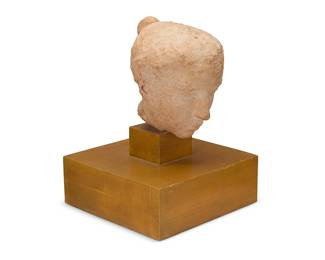 323
Bruno Calvani (1904-1985)
A classical-style ceramic bust of a woman, mid/late 20th century
With incised signature to base of neck: B Calvani; inscribed in pencil to underside: Maureen Zamparelli
Set on a tiered wood base
Bust: 9" H x 7.5" W x 8.5" D; With base overall: 14.75" H x 11" W x 11" D
Estimate: $800 - $1,200