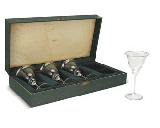 57
A set of four Gucci glass goblets
Late 20th century
Each marked: GUCCI / P; box interior marked in gilt: Gucci
Each with gilt rim and housed in original box with fitted interior
4 pieces
Each goblet: 8.75" H x 4.5" Dia.; Box: 5.25" H x 22.75" W x 11.75" D
Estimate: $300 - $500