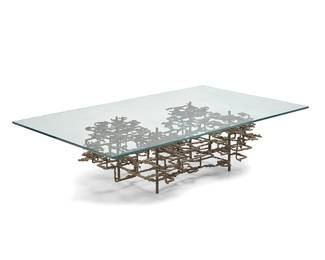 172
A Daniel Gluck Brutalist metal coffee table
Circa 1970s
Appears unmarked
With glass top
Base: 14.5" H x 53.5" W x 27.25" D; Glass: 0.625" H x 59.75" W x 36" D
Estimate: $1,000 - $2,000