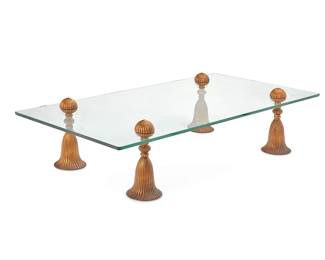 228
Phyllis Morris (1925-1988)
A tassel coffee table, late 20th century
Unmarked
The glass top supported on gilt-bronze tassel-form legs
17.5" H x 72" W x 36" D
Estimate: $700 - $900