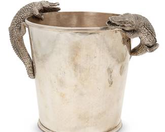 11
A Giovanni Raspini hammered sterling silver Champagne bucket
1990
Marked to underside: Giovanni Raspini / [star] 132 AR / 925
With applied crocodile figures to each side
9" H x 11.5" W x 8" D
56.1 oz. troy approximately
Estimate: $1,200 - $1,800