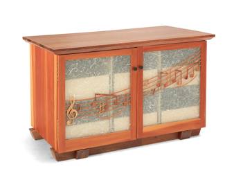 129
Harold Greene (b. 1953)
A Contemporary music cabinet, 2017
The Douglas fir cabinet with walnut top and glass doors constructed of two panes sandwiching mulberry paper, each front featuring mounted carved carob wood notes representing the blues song "CC Ryder," made famous by Big Bill Broonzy, opening to reveal six Finnish birch plywood sliding drawers, each fitted with adjustable slanted dividers for storing 12", 7", and 78 rpm vinyl records
32.375" H x 50.75" W x 25.75" D
Estimate: $600 - $800