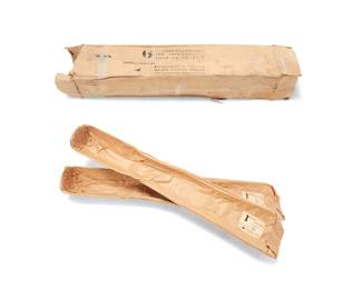 163
Charles and Ray Eames (1907-1978 and 1912-1988)
A pair of Molded Plywood Leg Splints by Evans Products Company with box, 1943
Designed 1941-1942
Each marked to original sticker: 1 Splint / Leg . Plywood / For Transportation / Stock No. S2-1790 / [Evans logo] / Manufactured by Evan Products Company / Molded Plywood Division / Los Angeles . California; box marked with matching stock number
The molded plywood splints, each wrapped in original paper packaging and with original box
2 pieces
Each: 42" L x 8" W x 4" D; Box: 42.75" L x 8.5" W x 8.5" D
Estimate: $600 - $800