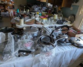 Kitchen.  Pots, pans, dishes, glass, tupperware, etc