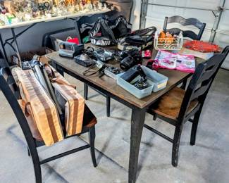Variety of garage items, kitchen table and chairs, vintage cameras 