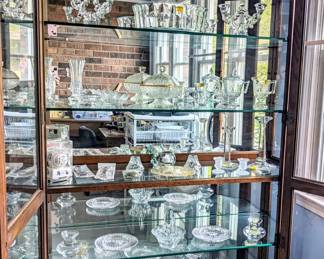 Large curio with variety of vintage glassware 