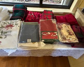 Many new and gently used Christmas Tablecloths