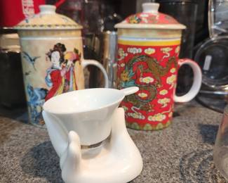 Oriental porcelain tea cups with tops